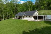 Live in the gourgeous 3100 sq ft home while you build your forever home up on the hill behind you