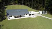 Secured; hidden a mile / at the end of your own gated private road is the renovated, 3BR home; Live here while you build your forever home on one of the several approved  5BR perc sites.