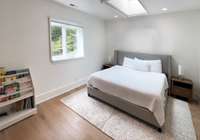 Upstairs to the 2nd level: there are 2 bedrooms - each with 2 extra large closets and skylights and window shades that darken with a push of a button. You'll be amazed at how spacious the home feels.