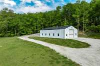 This newly constructed barn is fully insulated and would be perfect for your car collection, studio or workshop!