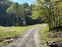 Private road - off of Drury Lane. There is an additional 5 acre 5 BR approved building site that may be purchased with this property.