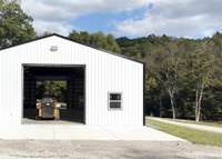 Back side of the storage barn-plenty of rooms for RV's, tractors or a tour bus.