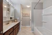 Secondary bathroom is oversized and perfect for sharing.