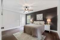 Beautiful wainscoating wall gives this oversized room character.