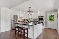 All new stainless steel appliances, including a double oven.