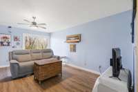 The Den has new LPV flooring, nice sliding glass door leading to a covered patio and balcony overlooking the greenway