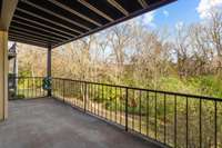 Another angle shows how large the covered back patio is and the view is private. Lots of trees and creek