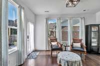 The Florida room has so much sunlight and would make a great home office.