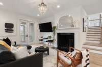 The living room has a wood burning fireplace with a gas starter
