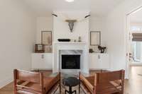 Front room has a gorgeous gas fireplace and built-in cabinets as well as pocket doors