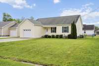 One-story home with an attached garage and a spacious yard—ready for its next owner!
