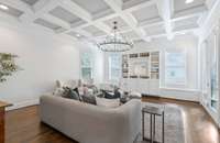 An even larger living room in the back- space for everyone! Walks out to screened porch