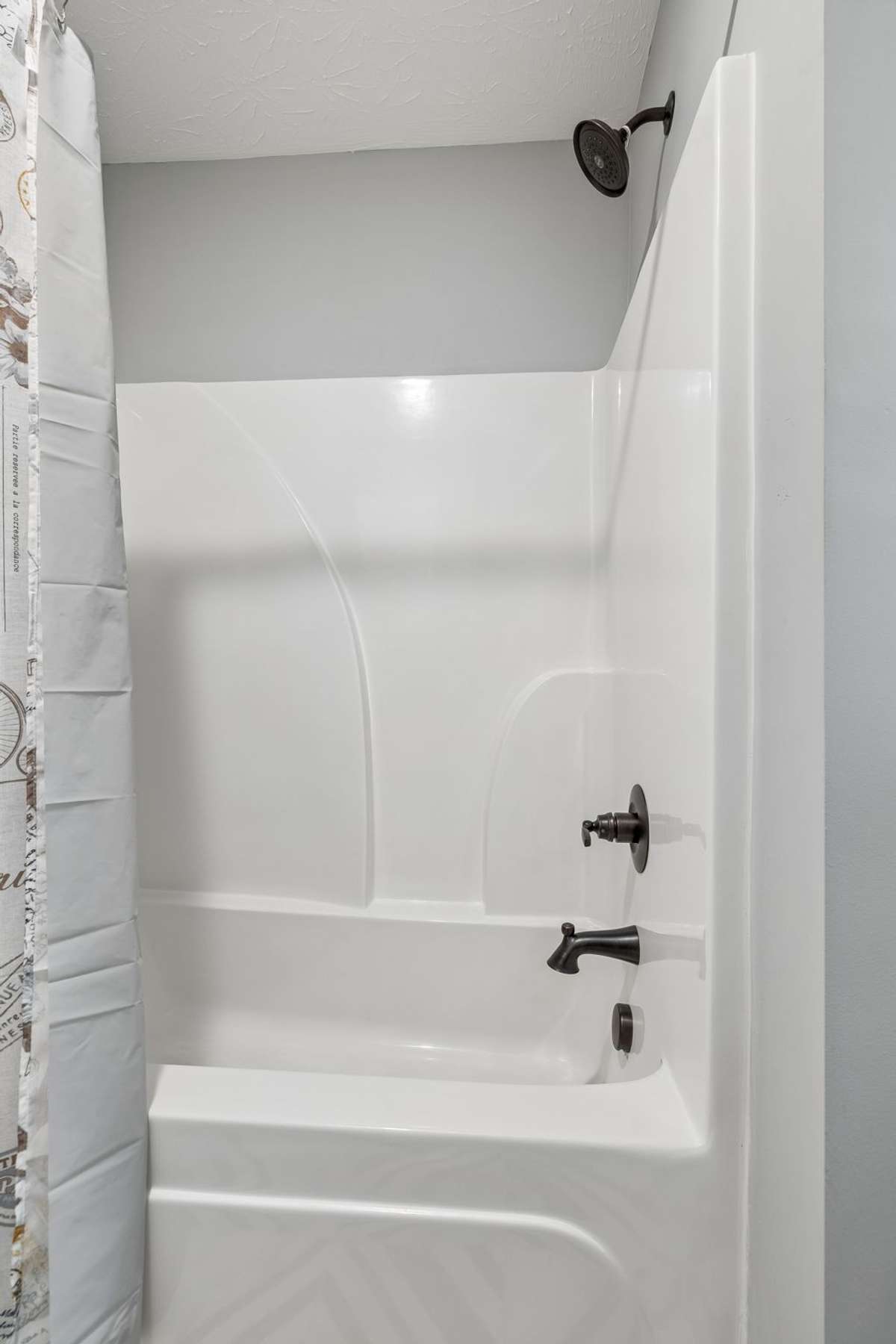 Primary bathroom with functional layout and ample storage.