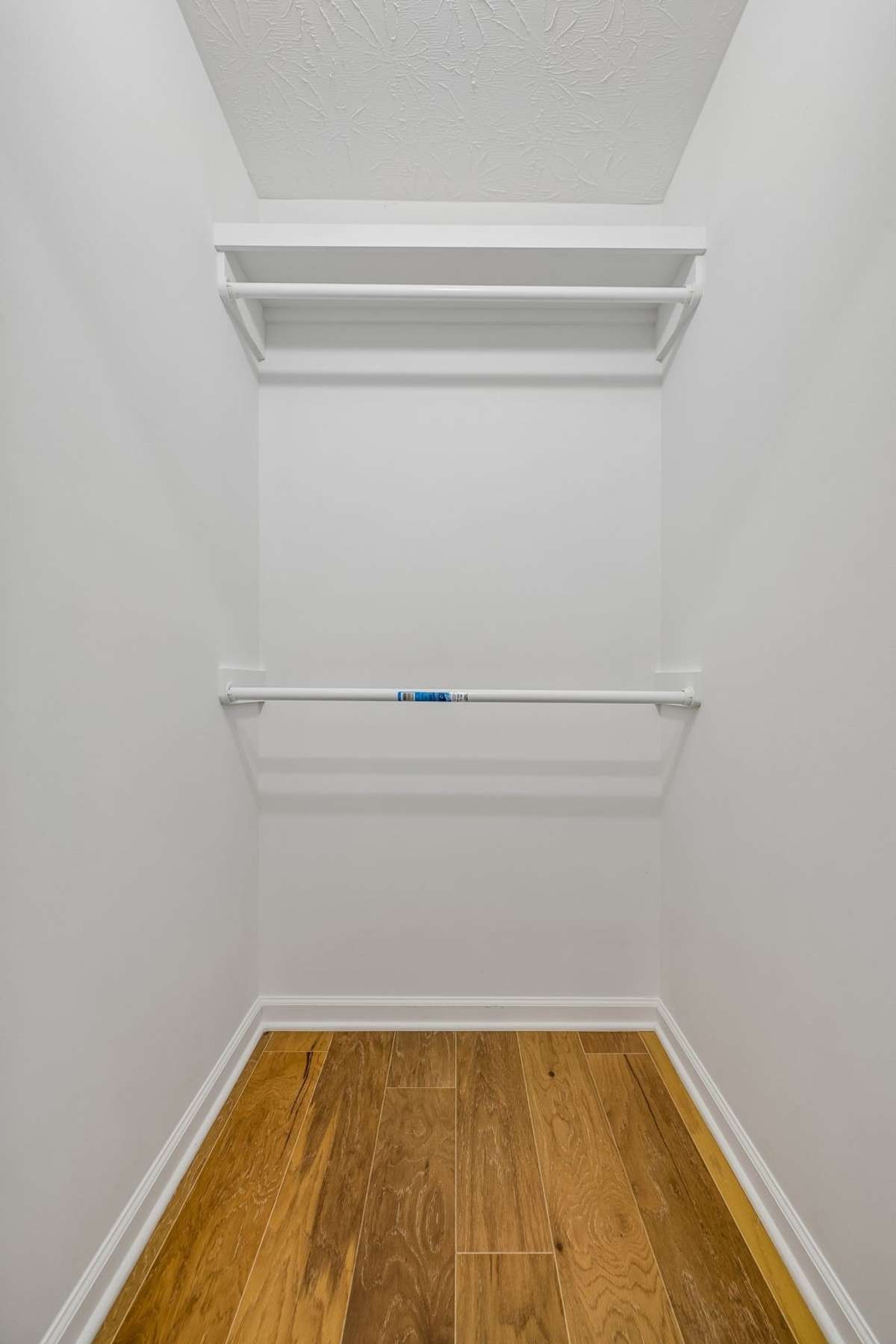 First of two walk-in closets in the primary suite, providing excellent storage.