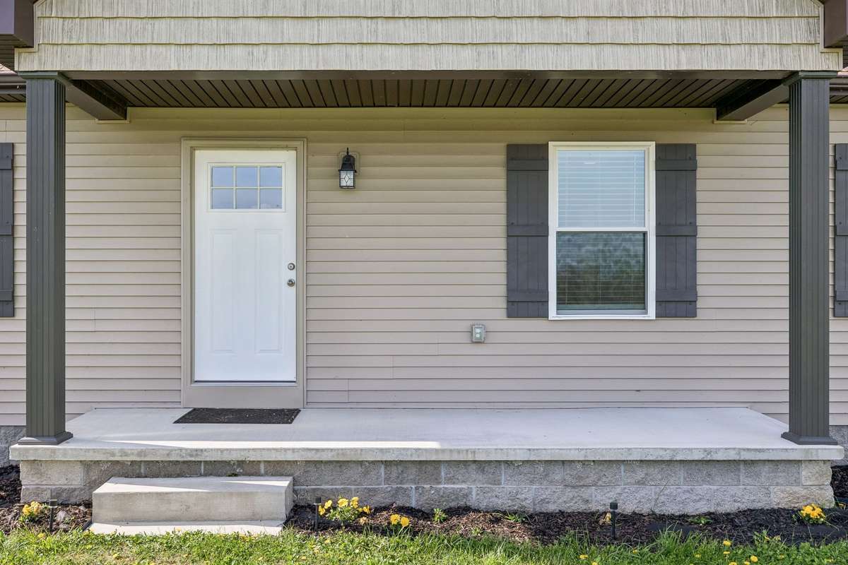 Cozy and convenient covered front porch with a beautiful view!