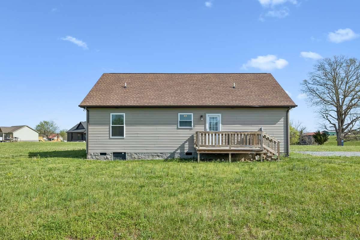 Expansive backyard with plenty of room to play, garden, or enjoy the outdoors.