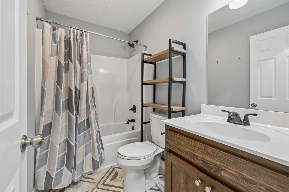 Full guest bathroom conveniently located for secondary bedrooms and visitors.