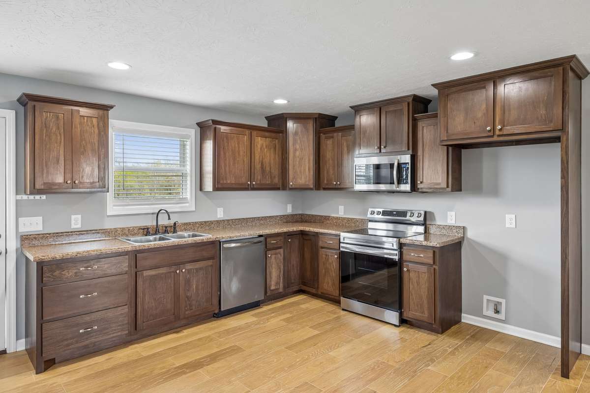 Well-appointed kitchen with modern finishes, ample cabinetry, and a layout designed for both cooking and gathering.