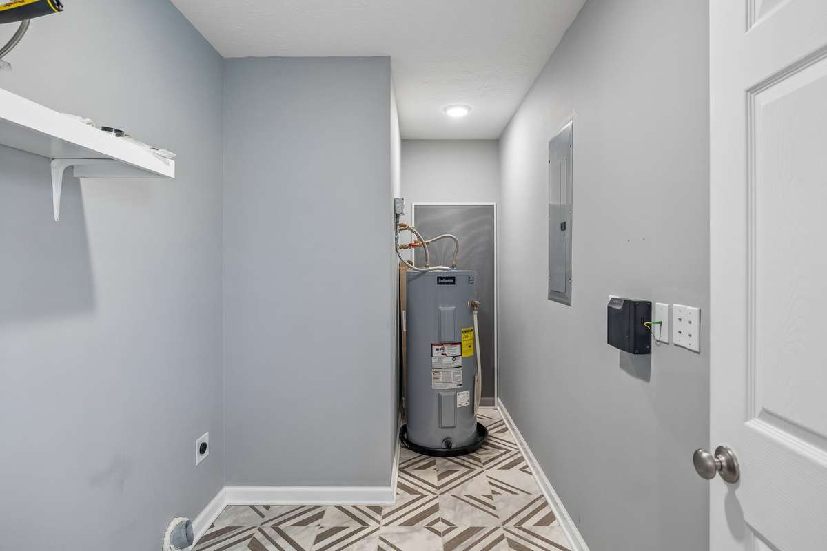 Oversized utility room with extra space for storage and functionality.