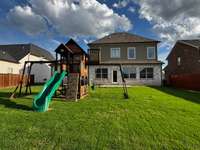 Beautiful and well-groomed yard with a patio attached for cookouts for family gatherings!