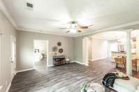 Whether you prefer a cozy TV nook, formal seating, or a reading area, this room easily adapts.