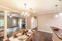 Conveniently located just off the kitchen, the dining room is perfect for both everyday meals and entertaining.