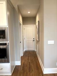Hallway from kitchen to laundry room and 3 car garage