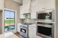 Professional grade stainless steel appliances with natural gas cooktop stove and a  pot filler!