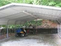 Carport is equipped with fish and game cleaning table and sink, with running water for clean-up