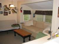 Den, with couch and two futons