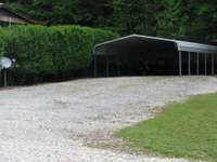 Extra wide  driveway, making it easy to back boat under carport.