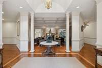This thoughtfully designed circular flow creates an open and inviting atmosphere, perfect for both everyday living and entertaining.  The gorgeous hardwood floors throughout have been beautifully maintained - note the stunning decorative inlay here