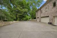 The expansive driveway and oversized four car garage is ideal for car collectors or multiple drivers in a household.