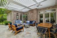 What a lovely place to gather with friends and family to enjoy a meal or just relax in the sitting area. The custom pergola structure has a rain sensor so closes automatically during inclimate weather.