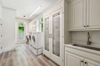This fully renovated laundry room has all new flooring and appliances, along with an unbelievable amount of storage!  The "overflow pantry" is loaded with pull out shelves and drawers, and there are two additional closets.
