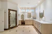 All new tile work in the shower and a separate makeup station are wonderful enhancements to the space.