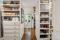 This swoon-worthy primary closet measures 18x13 and has convenient access to the newly renovated laundry area beyond.