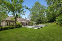 This is a second large grassy area on the other side of the pool - plenty of room here for a swingset or to add a comfortable hammock.