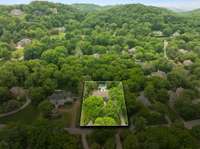 Majestically situated in the rolling hills of this quiet neighborhood - yet minutes from all the conveniences of Brentwood, Franklin and downtown Nashville