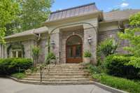 This elegant entrance sets the stage for what is inside!  The mahogany wood doors with beveled glass are stunning!