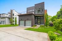 2-car garage with  mini-split HVAC unit, Gladiator shelving panels, & EV Charger.