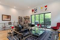 The large communal space offers incredible flexibility, with ample room for a library, music room, or additional seating to suit your lifestyle.