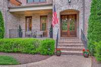 Spend time on the front porch, overlooking a serene common area in front.