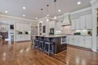 The size of this kitchen will certainly impress.  More than enough space for gatherings & celebrations.