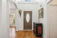 Bright, open foyer with high ceilings and hardwood floors—classic architectural details and natural light greet you.