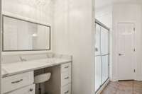 The primary bath has a dedicated makeup vanity area.