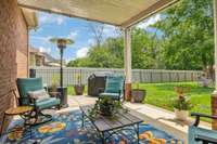 Relax or entertain on the covered back patio with garden views and room to grill.