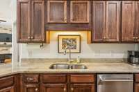 Dual-basin sink with upgraded faucet and under-cabinet lighting