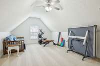 Spacious bonus room ideal for a home gym, game room, or guest space.