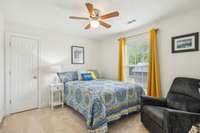 One of two bedrooms upstairs with plush carpet and natural light